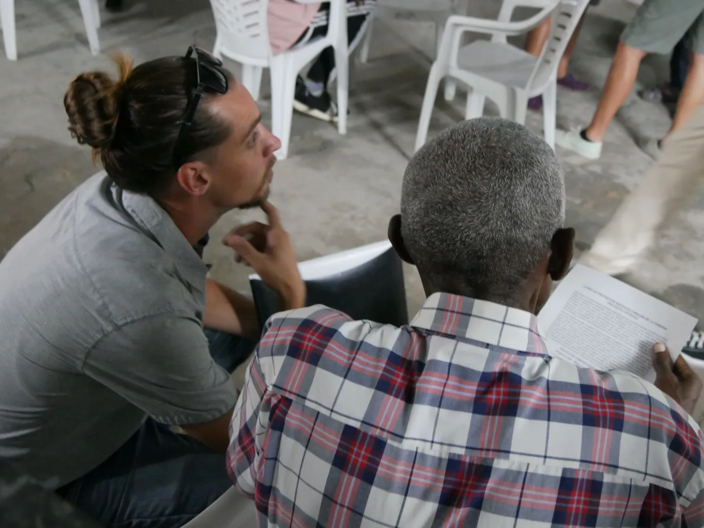 Researcher conducting a fieldwork interview with a community member